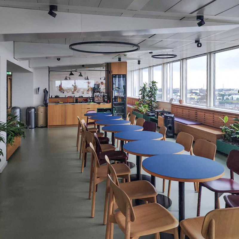 View across several tables with chairs in the slashwhy office